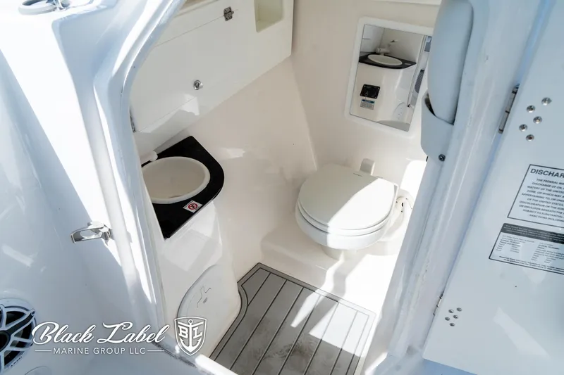 Slide: The Image of 2024 Sea Fox 288 Traveler Dual Console boat interior with toilet and sink. - 9