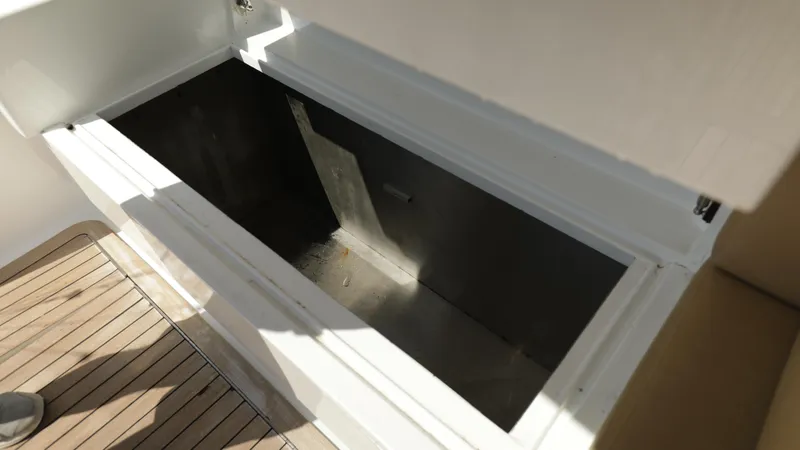 Slide: The Image of Open storage compartment on 2003 Custom Carolina Dean Johnson boat. - 16