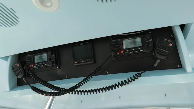Slide: The Image of Custom Carolina Dean Johnson 2003 boat communication equipment with radios and microphones. - 23