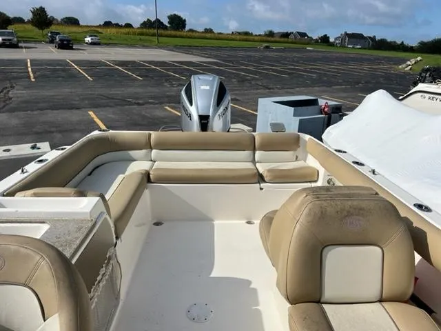 Slide: The Image of 2020 Key West 239 DFS boat with beige seating in a parking lot. - 14