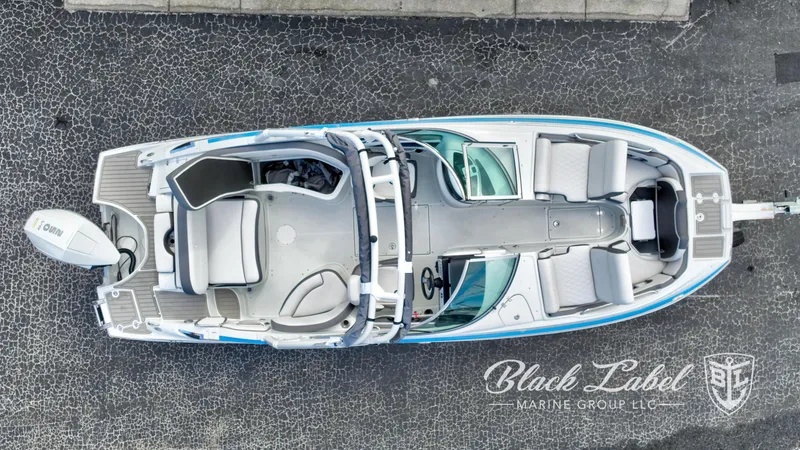 Slide: The Image of 2024 Crownline E260 XS boat, aerial view, sleek design, spacious seating, Black Label Marine Group. - 12