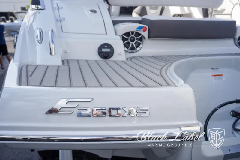 Slide: The Image of 2024 Crownline E260 XS boat deck with logo and branding details. - 13