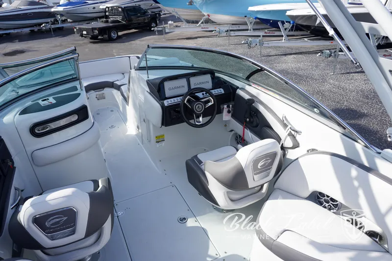 Slide: The Image of 2024 Crownline E260 XS boat interior with modern dashboard and seating. - 27