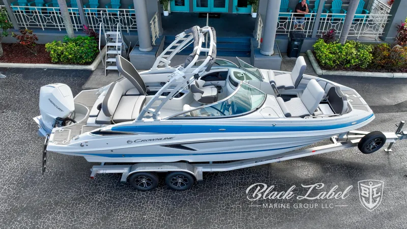 Slide: The Image of 2024 Crownline E260 XS boat on trailer, displayed by Black Label Marine Group. - 4
