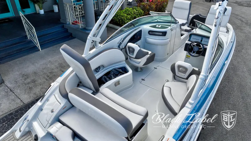 Slide: The Image of 2024 Crownline E260 XS boat interior with modern seating and dashboard. - 6