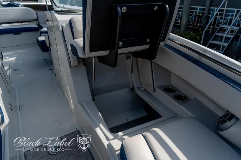 Slide: The Image of 2024 Crownline E260 XS boat interior with seating and storage compartments. - 11