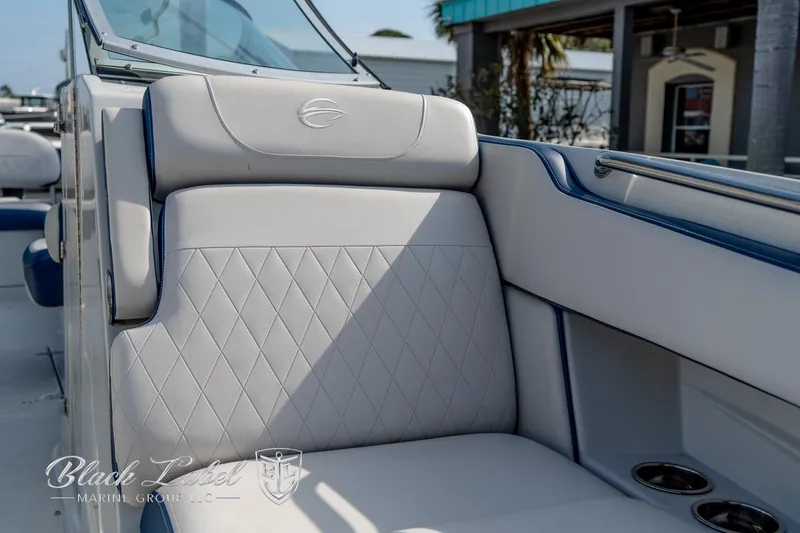 Slide: The Image of 2024 Crownline E260 XS boat interior with luxurious seating and elegant design. - 13