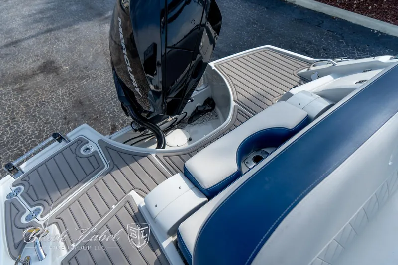 Slide: The Image of 2024 Crownline E260 XS boat with sleek deck and seating area. - 34
