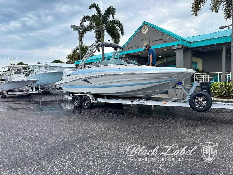 Slide: The Image of 2024 Crownline E280 XS boat on a trailer at Black Label Marine Group. - 12