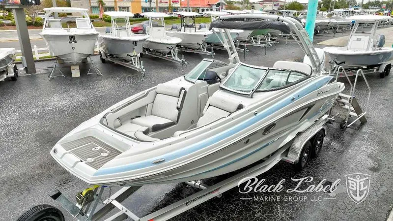 Slide: The Image of 2024 Crownline E280 XS boat on trailer at Black Label Marine Group. - 17