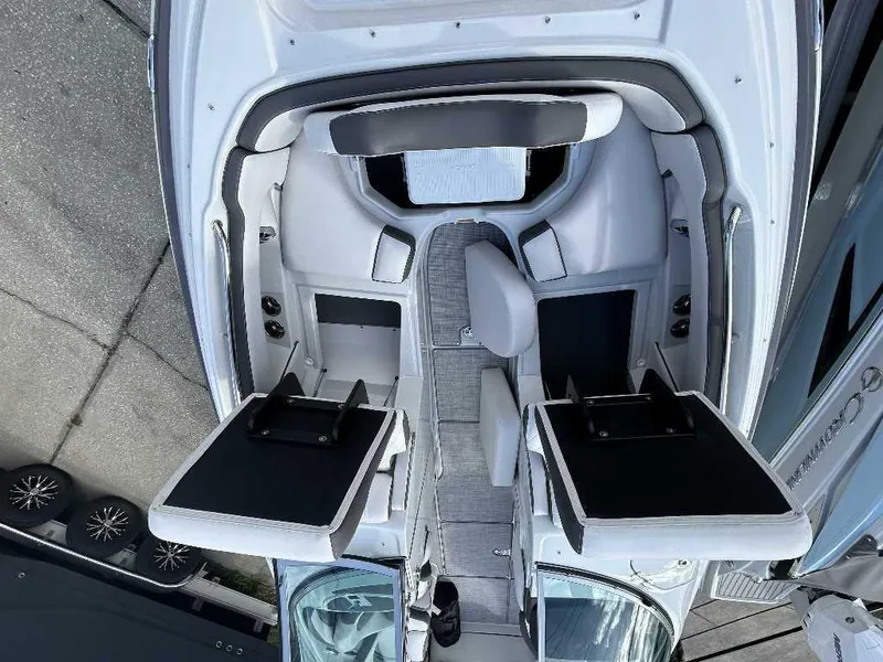 Slide: The Image of 2024 Crownline E280 XS boat interior with seating and storage compartments. - 2