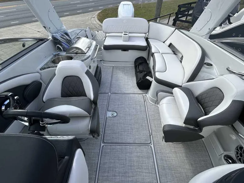 Slide: The Image of 2024 Crownline E280 XS boat interior with luxurious seating and modern amenities. - 4