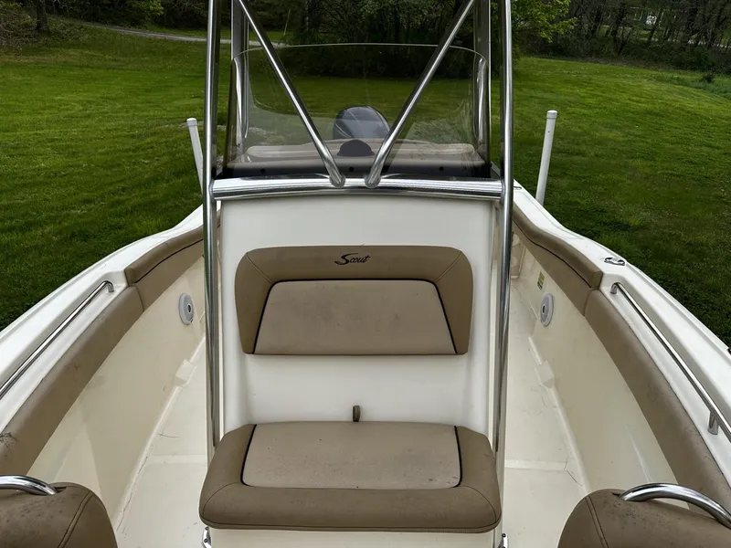 Slide: The Image of 2018 Scout 225 XSF boat interior with tan seating and windshield. - 6