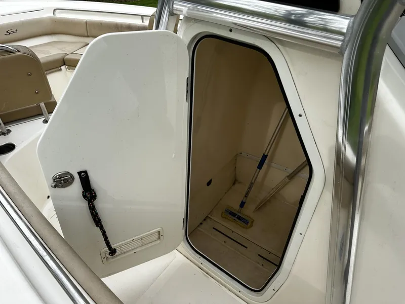 Slide: The Image of 2018 Scout 225 XSF boat storage compartment with open door. - 7
