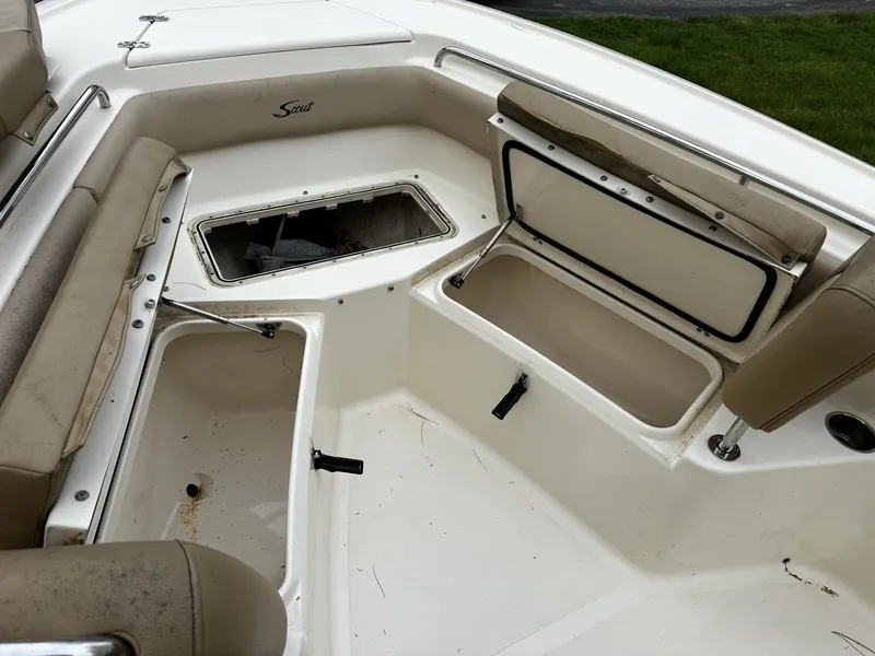 Slide: The Image of 2018 Scout 225 XSF boat interior with open storage compartments. - 8