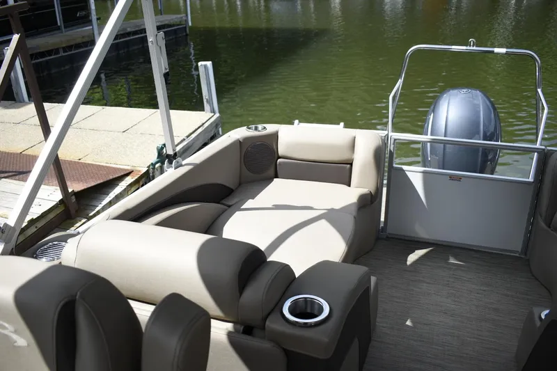 Slide: The Image of 2023 Bennington 22 SXCW pontoon boat with comfortable seating and cup holders. - 11
