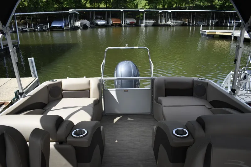 Slide: The Image of 2023 Bennington 22 SXCW pontoon boat interior with comfortable seating and cup holders. - 12