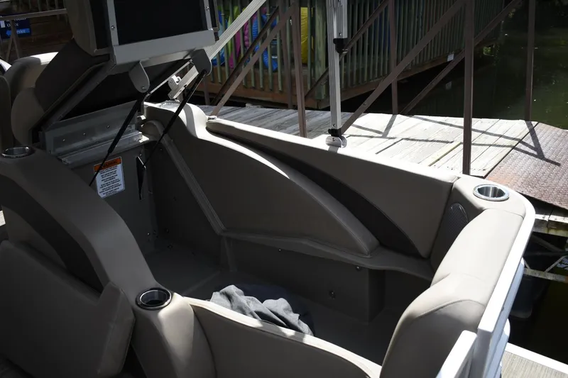 Slide: The Image of 2023 Bennington 22 SXCW boat interior with seating and cup holders. - 13