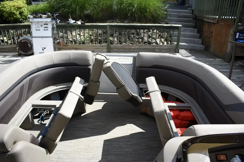 Slide: The Image of 2023 Bennington 22 SXCW boat interior with seating and storage compartments. - 6