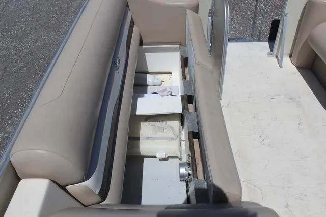 Slide: The Image of Storage compartment in 2013 Fiesta 22 Fundeck boat with beige seating. - 15