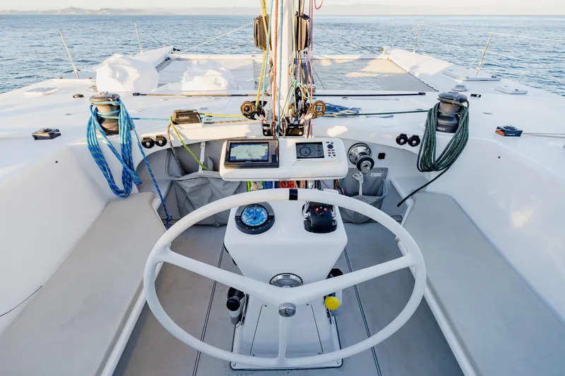 Slide: The Image of Cockpit of 2009 Chris White Atlantic 57 catamaran with steering wheel and navigation instruments. - 4