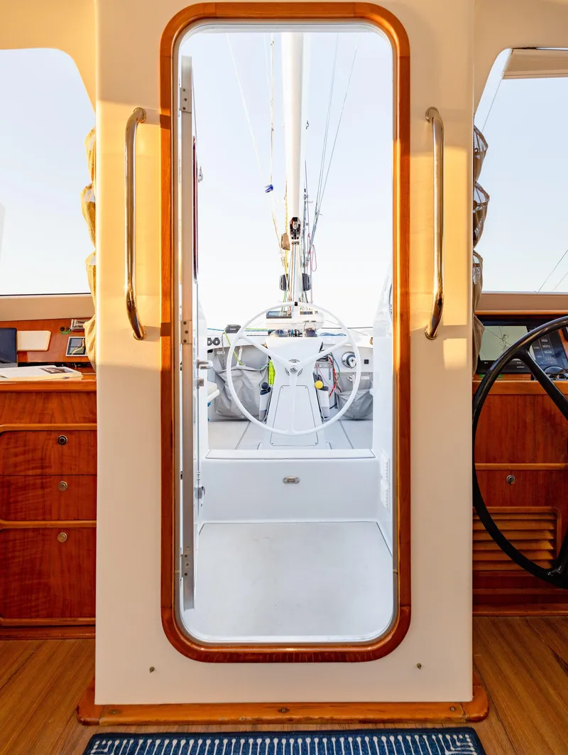 Slide: The Image of Interior view of 2009 Chris White Atlantic 57 yacht, showcasing helm through doorway. - 8