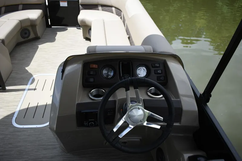 Slide: The Image of 2023 Bennington 23 XSL3 boat interior with steering wheel and dashboard. - 8