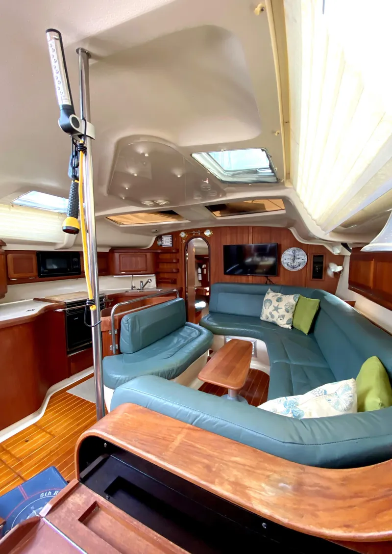 Slide: The Image of Interior of a 1997 Hunter 430 yacht with spacious seating and modern amenities. - 13