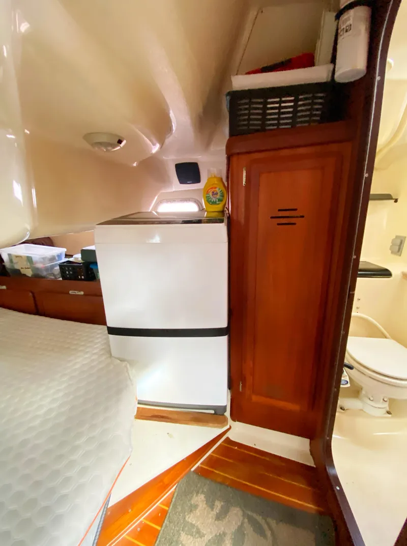 Slide: The Image of Interior of a 1997 Hunter 430 yacht with compact kitchen and bathroom. - 41