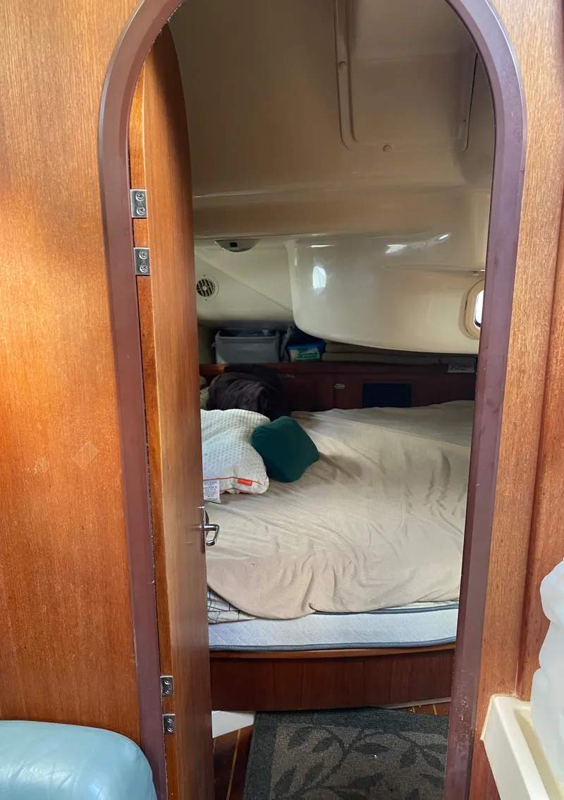 Slide: The Image of Cozy cabin interior of a 1997 Hunter 430 sailboat with a comfortable bed. - 45