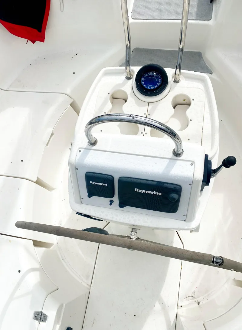 Slide: The Image of Cockpit of 1997 Hunter 430 sailboat with navigation instruments and steering wheel. - 48