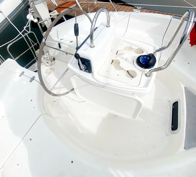 Slide: The Image of Cockpit of 1997 Hunter 430 sailboat with steering wheel and navigation instruments. - 50