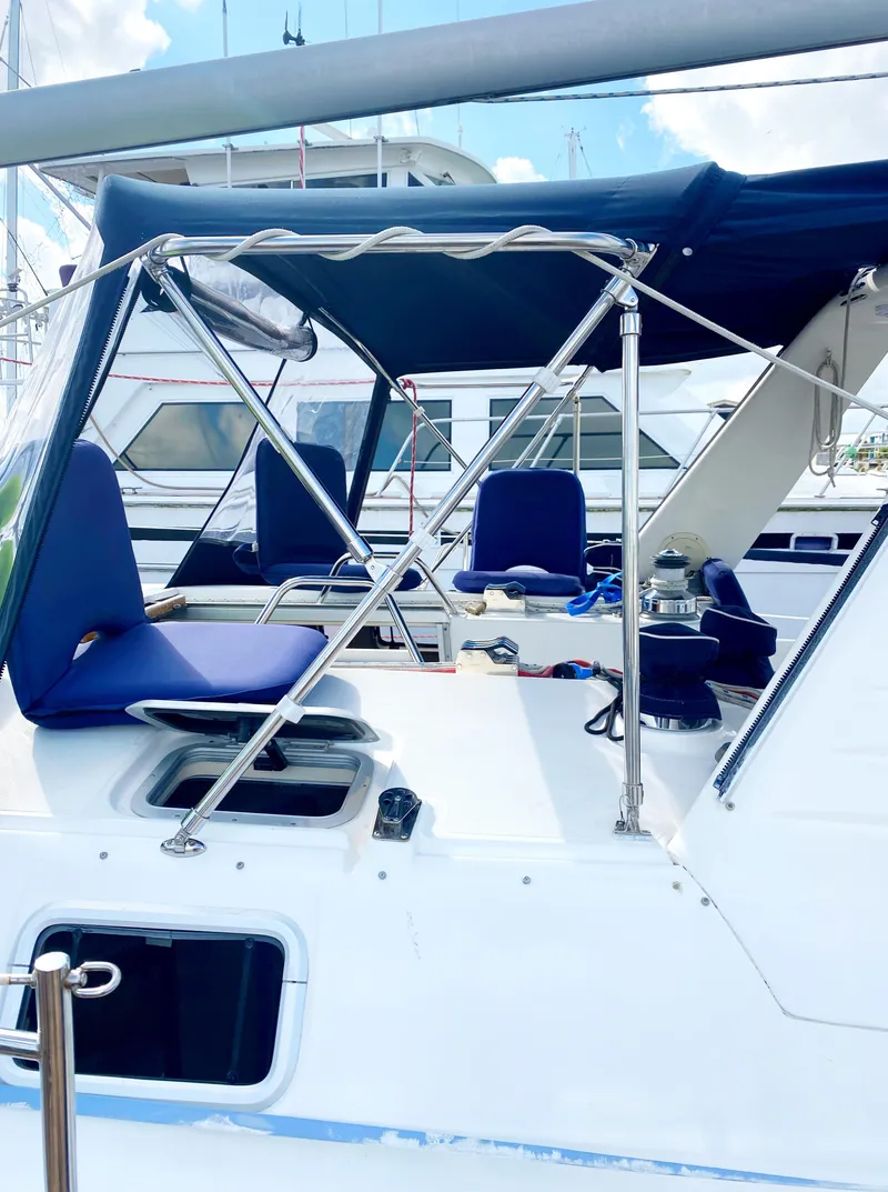 Slide: The Image of Hunter 430 sailboat, 1997 model, featuring a blue canopy and seating area. - 7