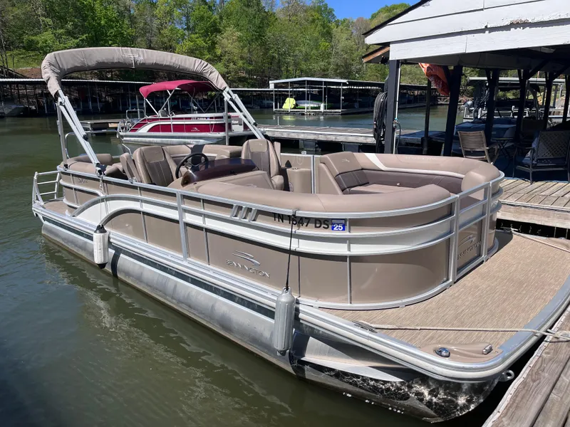 Slide: The Image of 2023 Bennington 22 SXSR pontoon boat docked on a sunny day. - 3