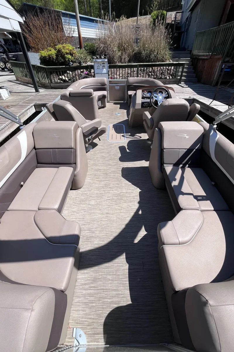 Slide: The Image of 2023 Bennington 22 SXSR pontoon boat with spacious seating and modern design. - 5