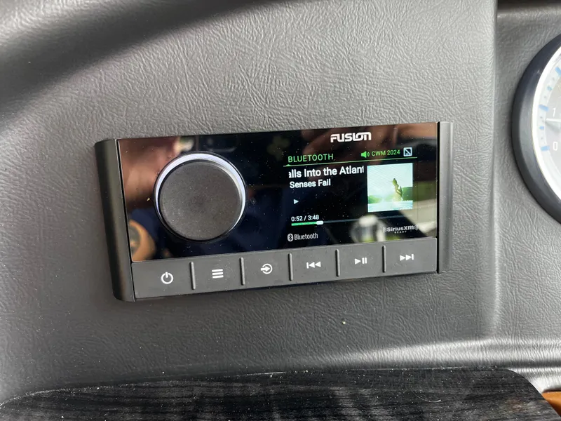 Slide: The Image of Fusion Bluetooth stereo system on 2024 Avalon Catalina Funship - 25' boat dashboard. - 18