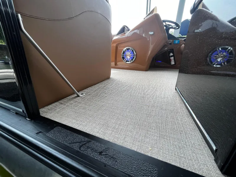 Slide: The Image of 2024 Avalon Catalina Funship 25' interior with modern dashboard and carpeted flooring. - 23