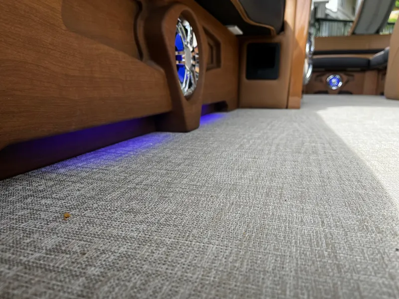 Slide: The Image of Interior of 2024 Avalon Catalina Funship 25' with carpet and blue LED lighting. - 25