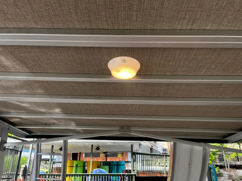 Slide: The Image of 2024 Avalon Catalina Funship 25' boat interior ceiling with light fixture. - 26