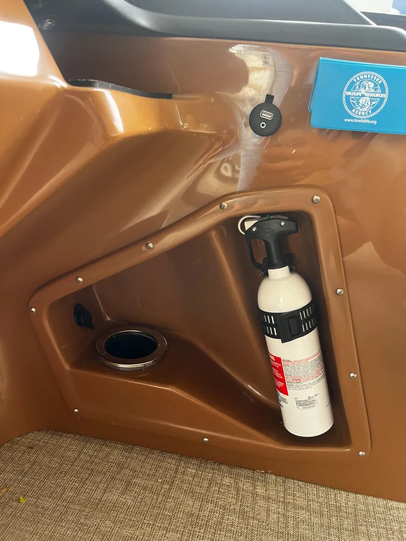 Slide: The Image of Fire extinguisher compartment on 2024 Avalon Catalina Funship 25' boat. - 28