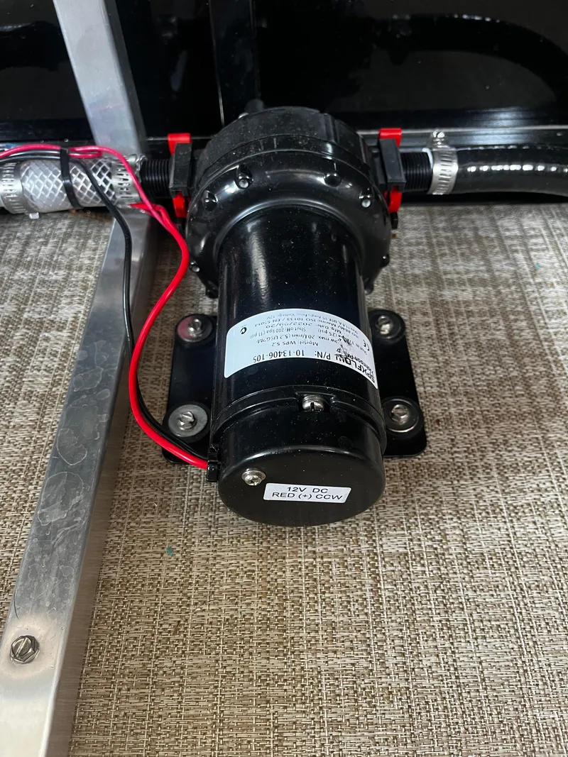 Slide: The Image of Close-up of a pump component in a 2024 Avalon Catalina Funship 25' boat. - 30