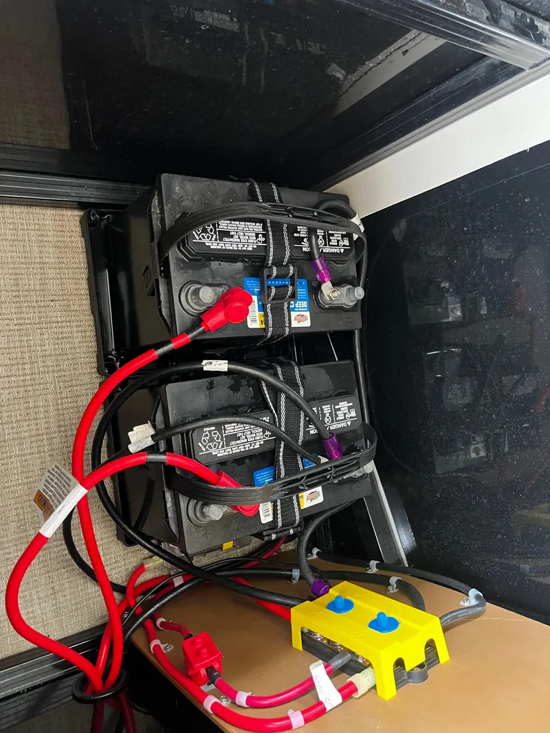 Slide: The Image of 2024 Avalon Catalina Funship 25' boat battery compartment with wiring. - 31