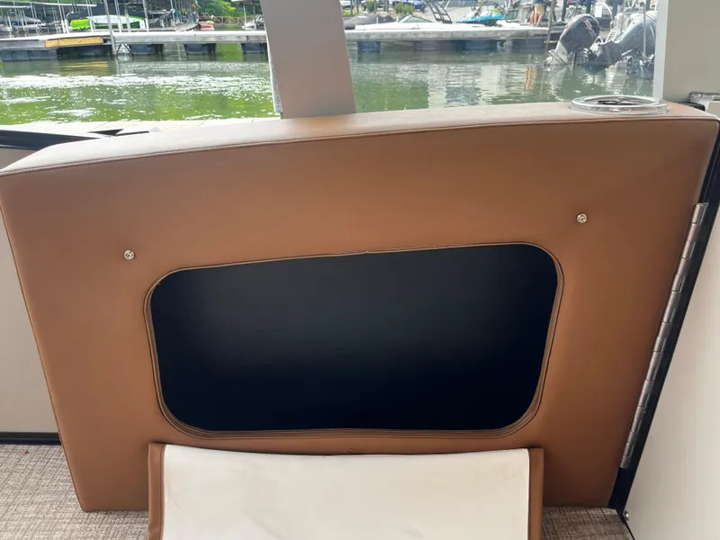 Slide: The Image of Interior seating of 2024 Avalon Catalina Funship 25' with water view in the background. - 39