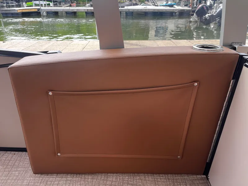 Slide: The Image of Brown seatback with pocket on 2024 Avalon Catalina Funship 25' boat, docked by the water. - 40