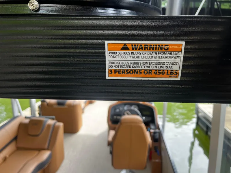 Slide: The Image of Warning label on 2024 Avalon Catalina Funship - 25' boat, capacity 3 persons or 450 lbs. - 43