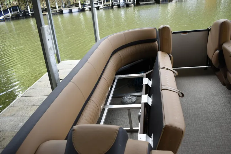 Slide: The Image of 2024 Avalon Catalina Funship 25' interior seating by the dock. - 8