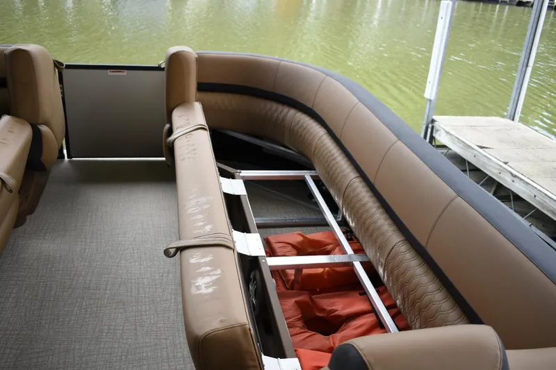 Slide: The Image of Interior of 2024 Avalon Catalina Funship 25' pontoon boat with storage compartment. - 9