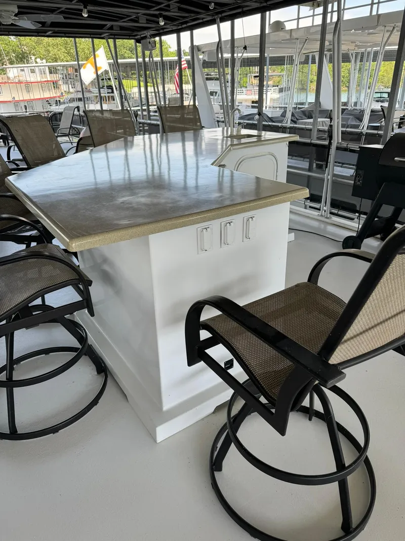 Slide: The Image of Interior of a 2003 Sharpe 75' Houseboat with bar seating. - 11