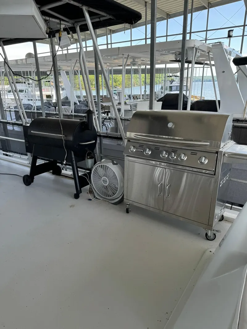 Slide: The Image of Outdoor kitchen area on a 2003 Sharpe 75' Houseboat with grill and smoker. - 13