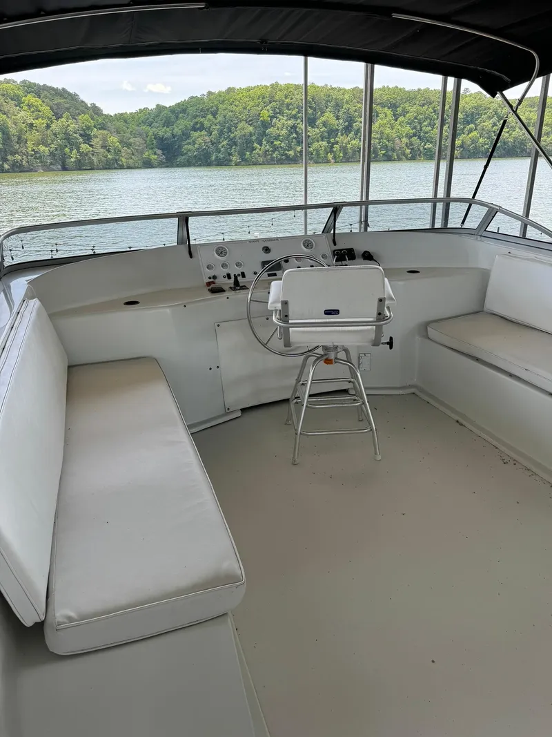 Slide: The Image of 2003 Sharpe 75' Houseboat helm with lake view and seating. - 14